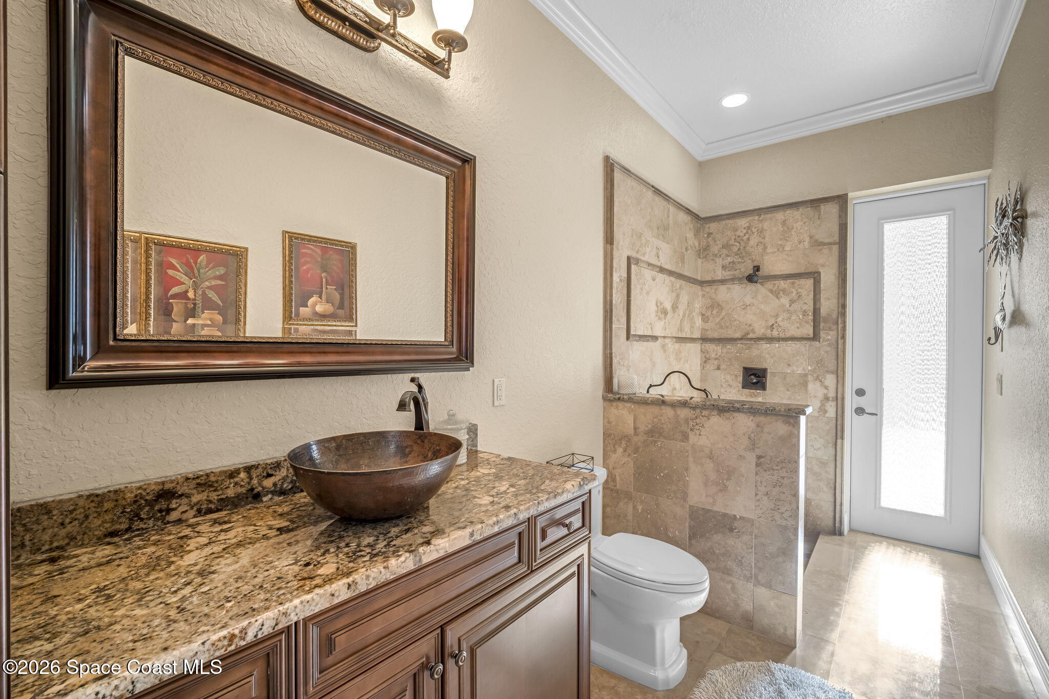 5454 Riveredge Drive Titusville, FL 32780 - Photo 42 of 70 a bathroom with a granite countertop toilet sink and mirror