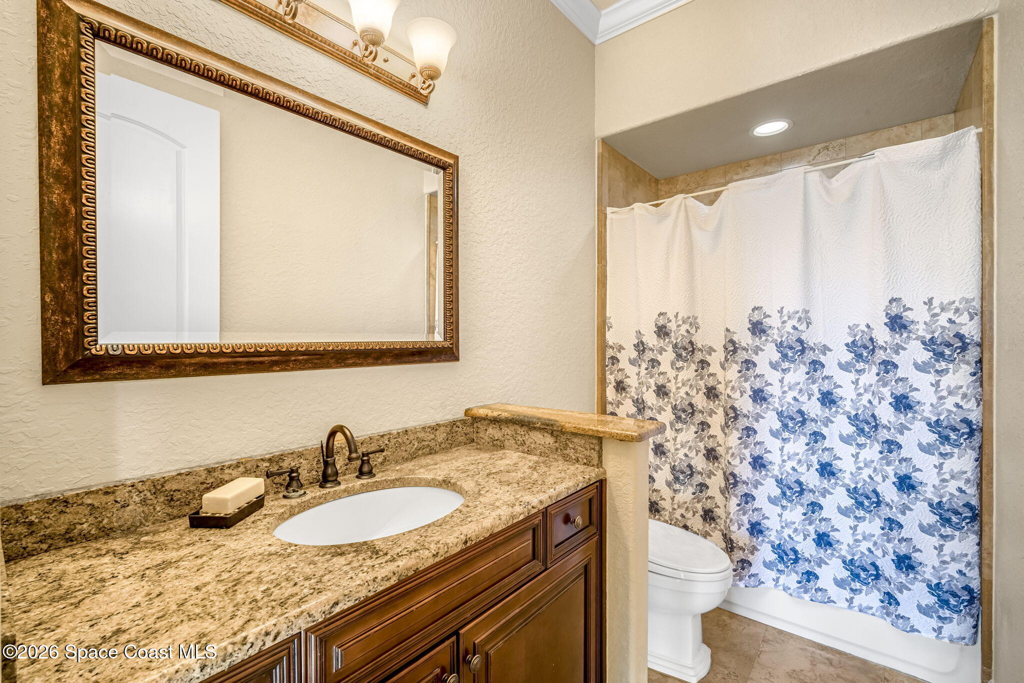 5454 Riveredge Drive Titusville, FL 32780 - Photo 43 of 70 a bathroom with a granite countertop sink and a mirror