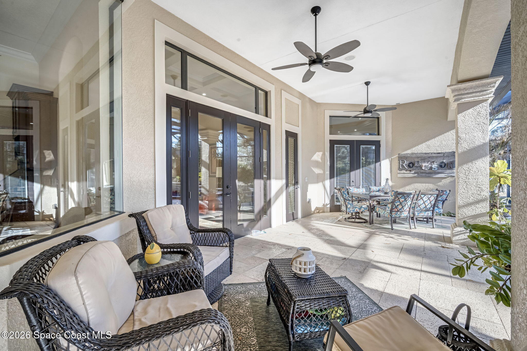 5454 Riveredge Drive Titusville, FL 32780 - Photo 46 of 70 a living room with furniture a large window and a table