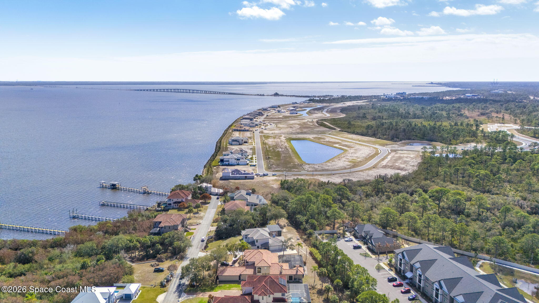 5454 Riveredge Drive Titusville, FL 32780 - Photo 60 of 70 an aerial view of a house with a yard and lake view