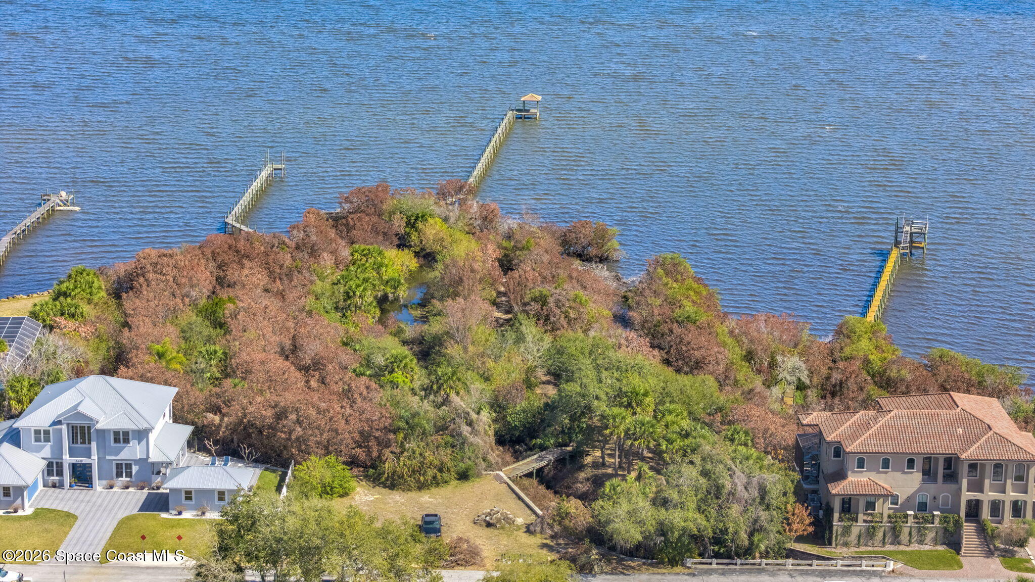 5454 Riveredge Drive Titusville, FL 32780 - Photo 64 of 70 a view of a house with a yard and sitting area