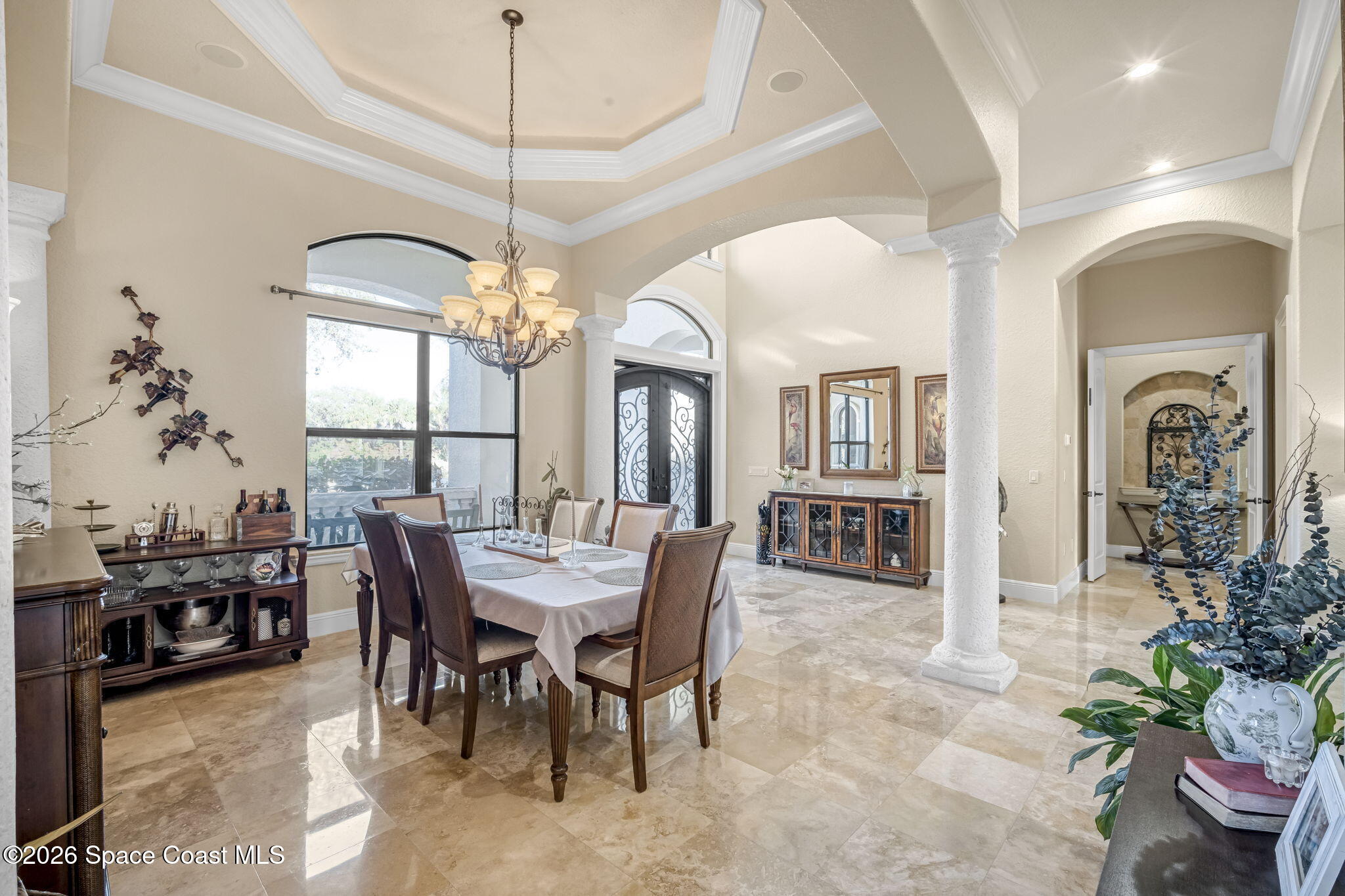 5454 Riveredge Drive Titusville, FL 32780 - Photo 7 of 70 a view of a dining room with furniture and chandelier