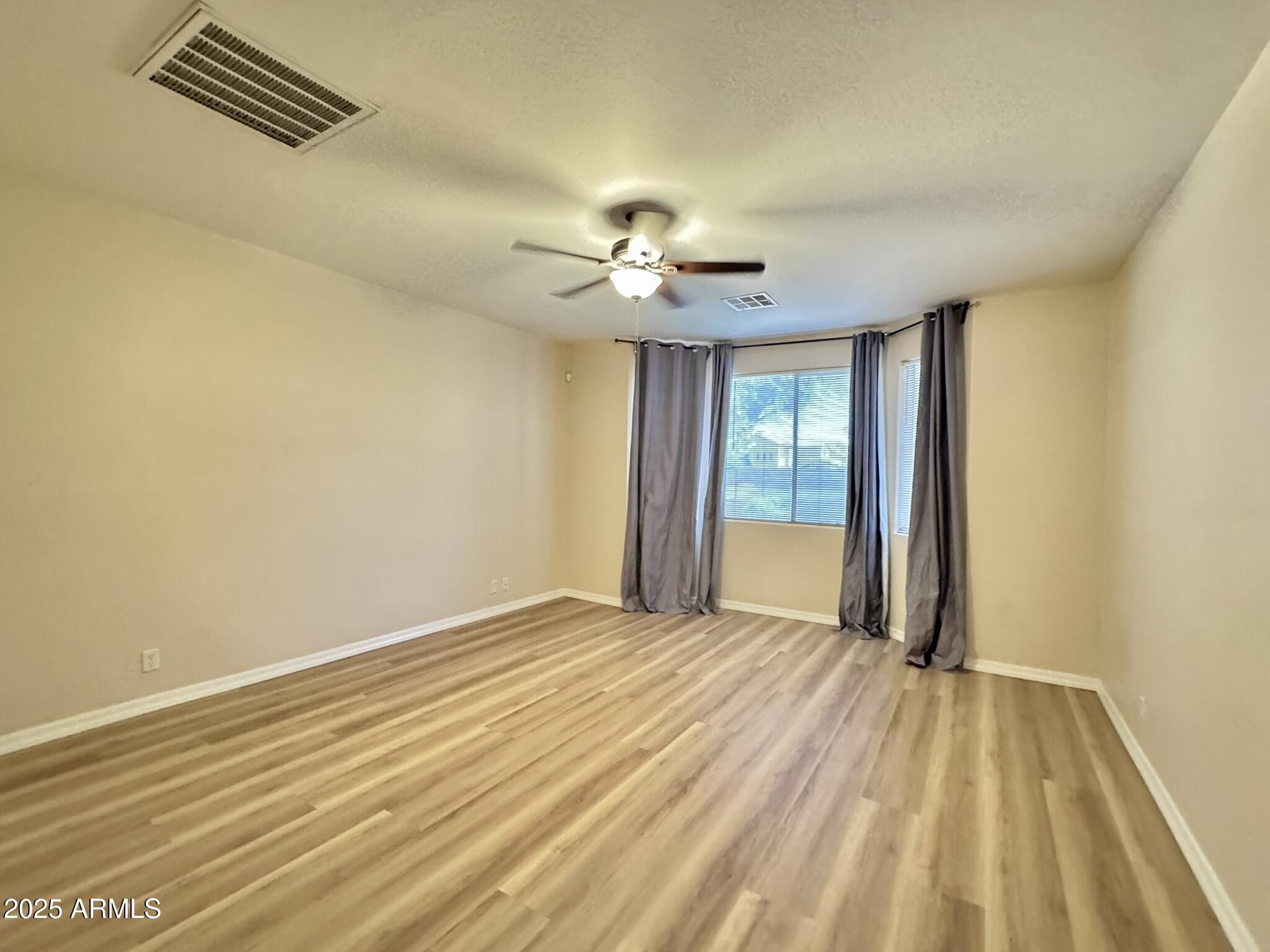 2671 South Dragoon Drive Chandler, AZ 85286 - Photo 12 of 41 a view of an empty room with a window