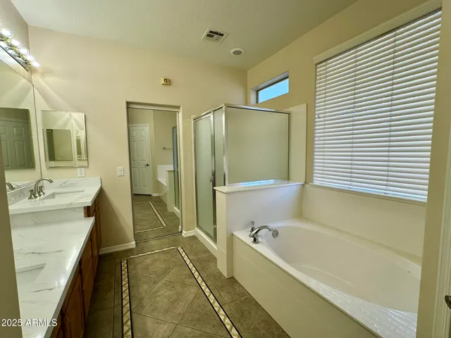 a bathroom with a bathtub and a sink