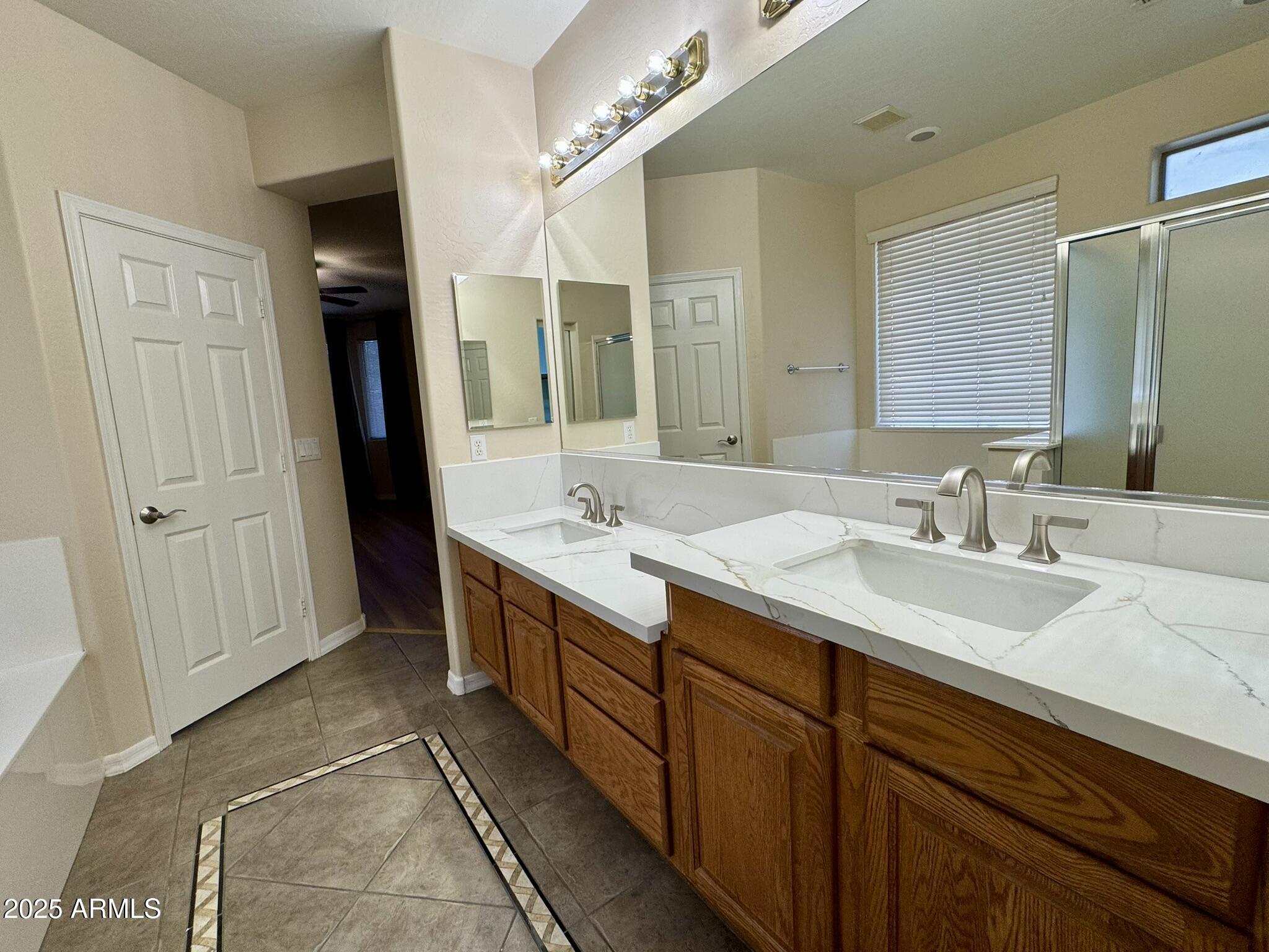 2671 South Dragoon Drive Chandler, AZ 85286 - Photo 15 of 41 a bathroom with a double vanity sink and a mirror
