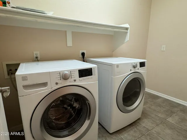 a utility room with dryer and washer