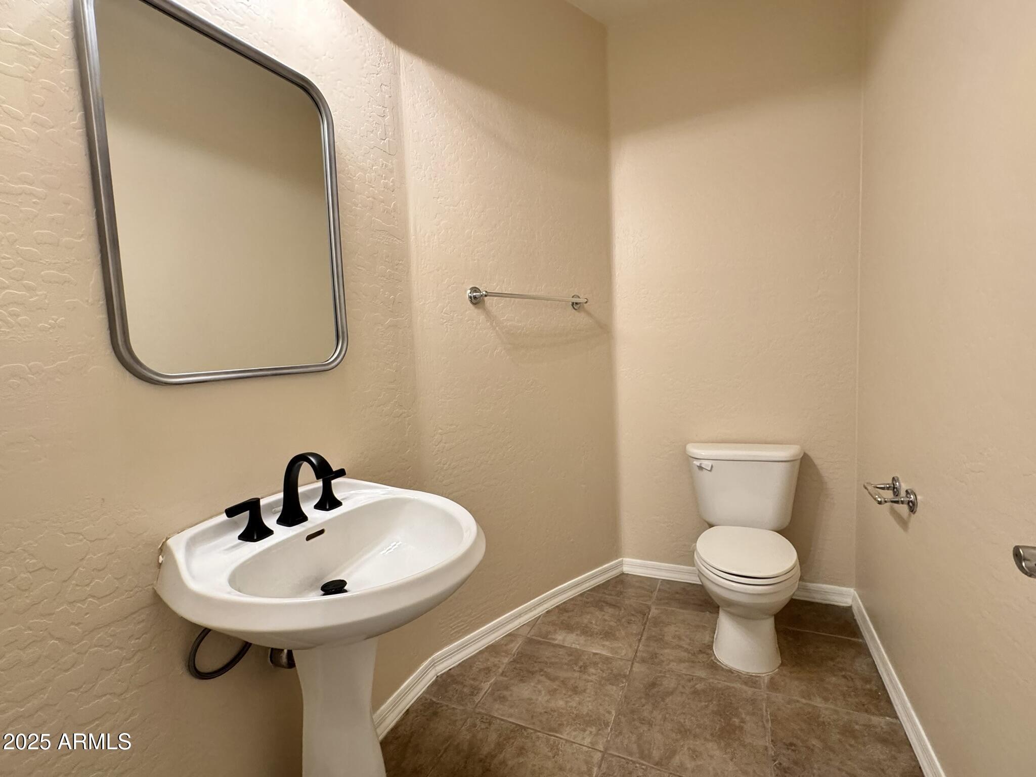 2671 South Dragoon Drive Chandler, AZ 85286 - Photo 18 of 41 a bathroom with a sink and a toilet