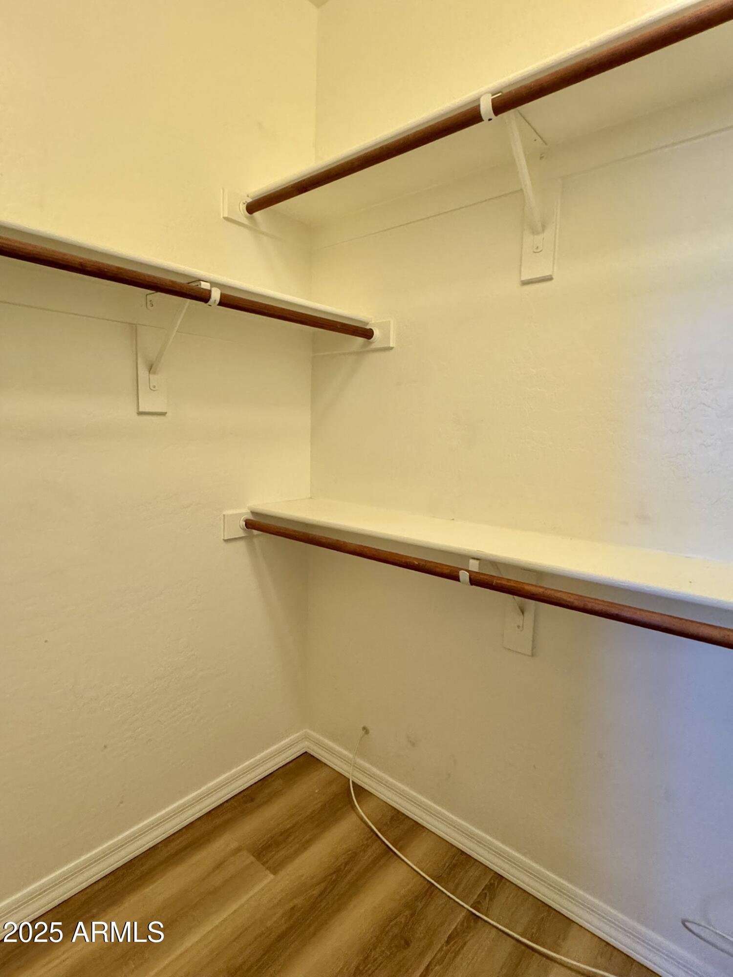 2671 South Dragoon Drive Chandler, AZ 85286 - Photo 21 of 41 a view of a room with racks on the wall