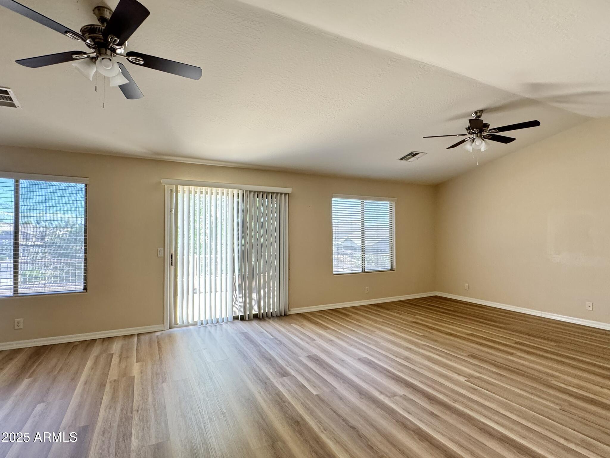 2671 South Dragoon Drive Chandler, AZ 85286 - Photo 24 of 41 wooden floor in an empty room with a window