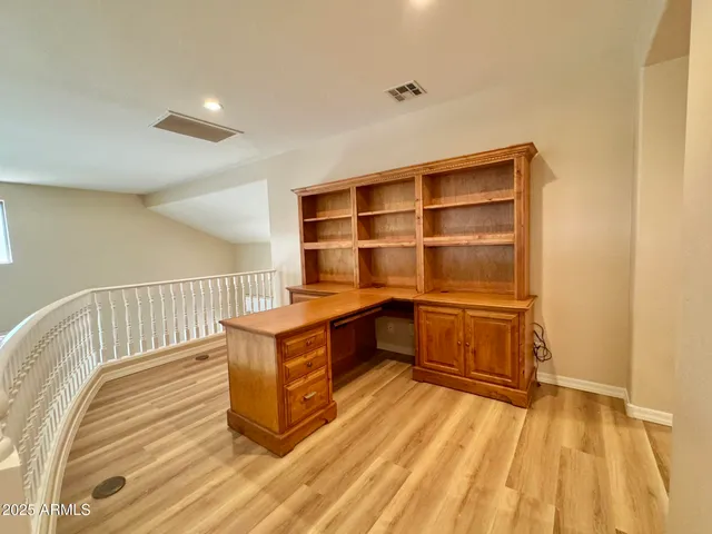 a room with stairs and a wooden floor