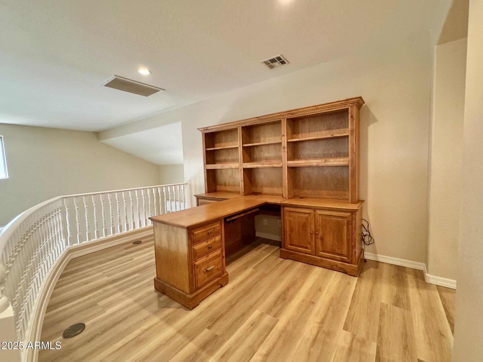 2671 South Dragoon Drive Chandler, AZ 85286 - Photo 34 of 41 a room with stairs and a wooden floor