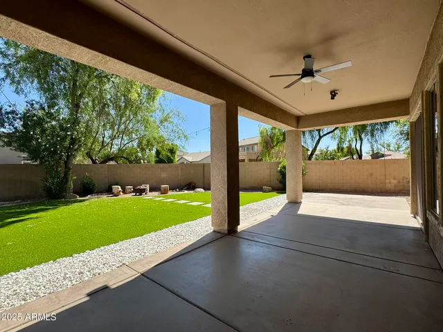 a view of a patio with a yard