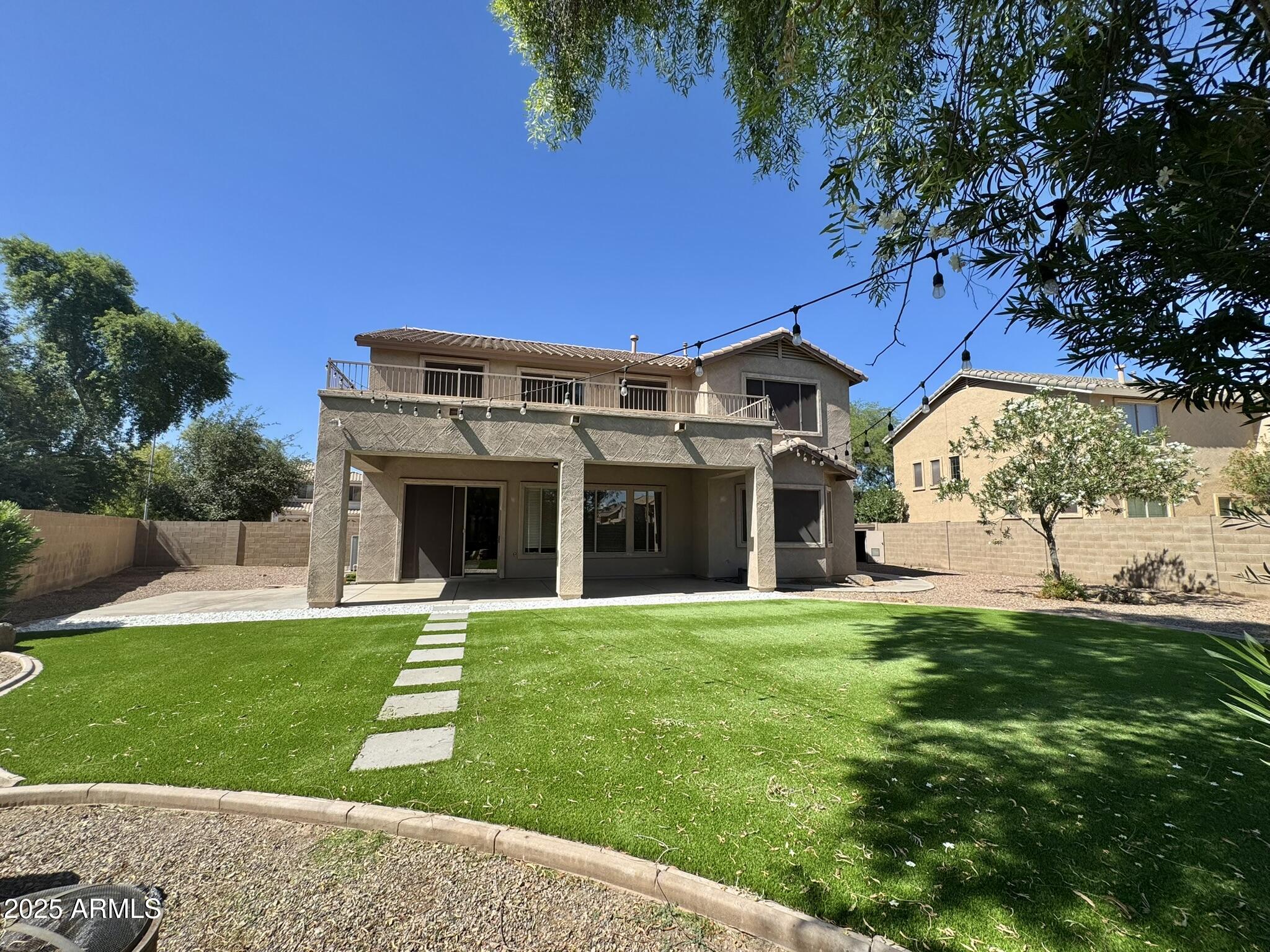 2671 South Dragoon Drive Chandler, AZ 85286 - Photo 39 of 41 a view of a house with a yard and potted plants