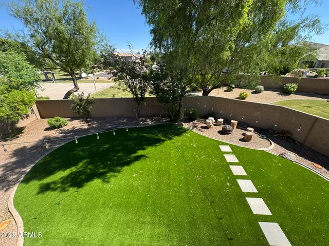 a view of a backyard with sitting area