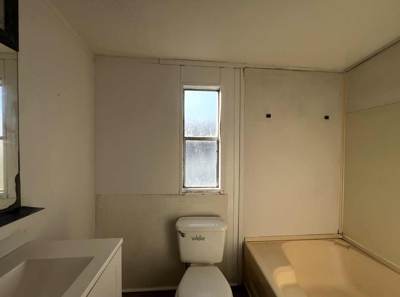 1511-4 Jones Street, Unit 4 Rosenberg, TX 77471 - Photo 6 of 11 a bathroom with a sink a toilet and shower