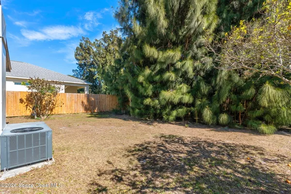 a view of a backyard of the house