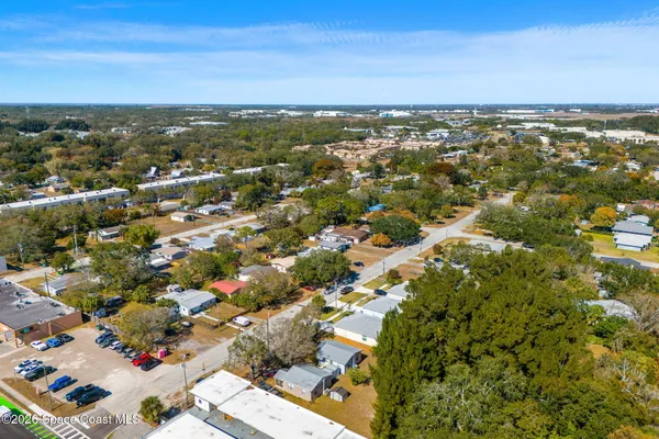 an aerial view of a city with lots of residential buildings