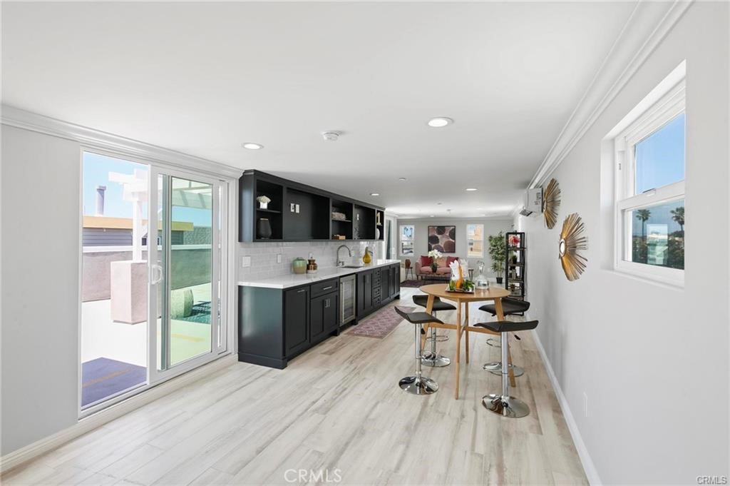 112 Van Nuys Avenue Oxnard, CA 93035 - Photo 24 of 58 a living room with furniture and a flat screen tv