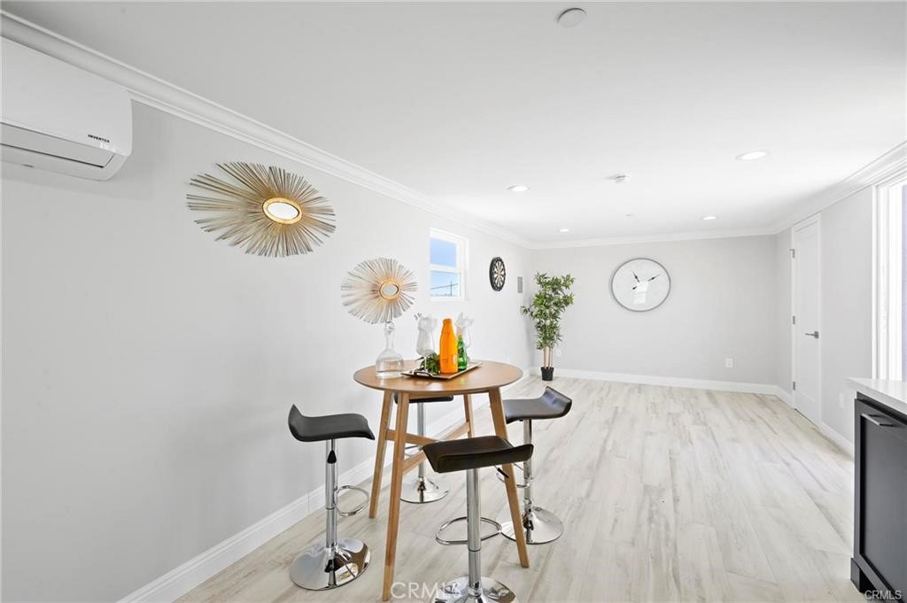 112 Van Nuys Avenue Oxnard, CA 93035 - Photo 26 of 58 a view of a dining room with furniture and wooden floor