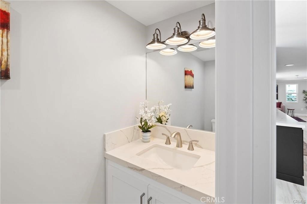 112 Van Nuys Avenue Oxnard, CA 93035 - Photo 27 of 58 a bathroom with a sink vanity and mirror