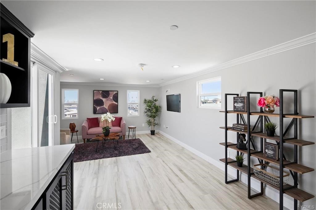 112 Van Nuys Avenue Oxnard, CA 93035 - Photo 28 of 58 a living room with furniture and a wooden floor