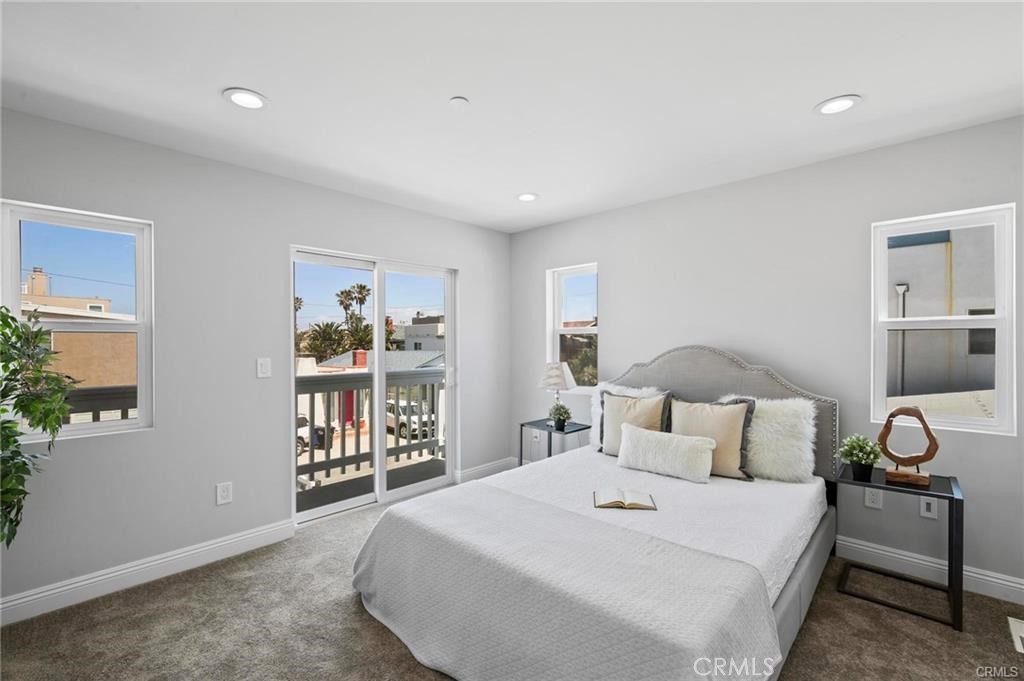 112 Van Nuys Avenue Oxnard, CA 93035 - Photo 31 of 58 a bedroom with a bed and a large window