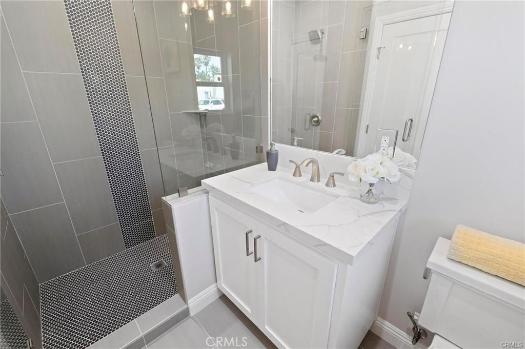 112 Van Nuys Avenue Oxnard, CA 93035 - Photo 38 of 58 a bathroom with a sink a toilet and shower