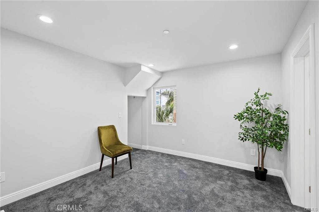 112 Van Nuys Avenue Oxnard, CA 93035 - Photo 42 of 58 a living room with furniture and a potted plant