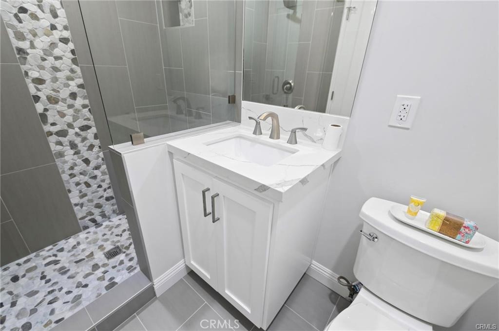 112 Van Nuys Avenue Oxnard, CA 93035 - Photo 44 of 58 a bathroom with a sink and a toilet