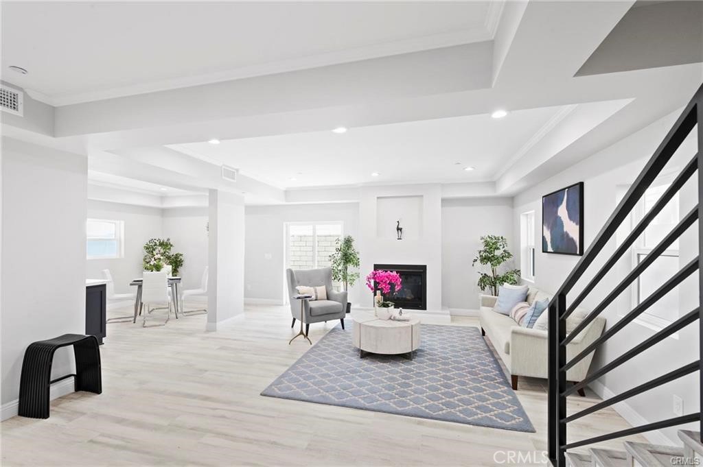 112 Van Nuys Avenue Oxnard, CA 93035 - Photo 7 of 58 a living room with furniture and a table