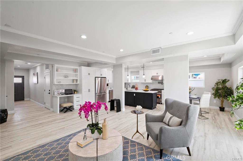 112 Van Nuys Avenue Oxnard, CA 93035 - Photo 9 of 58 a living room with furniture and flowers