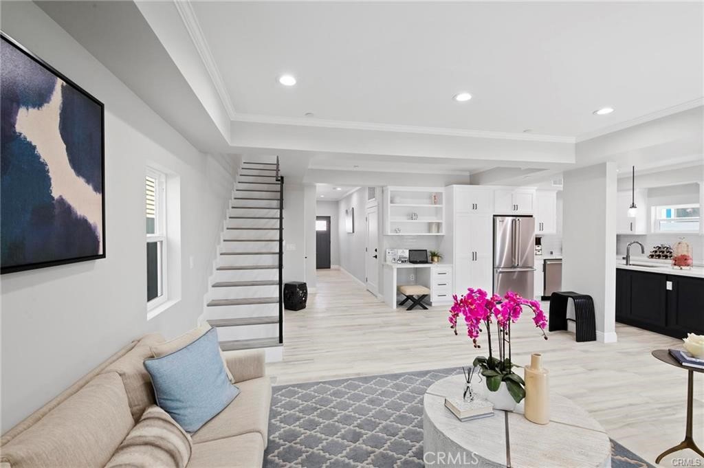 112 Van Nuys Avenue Oxnard, CA 93035 - Photo 10 of 58 a living room with furniture and flowers