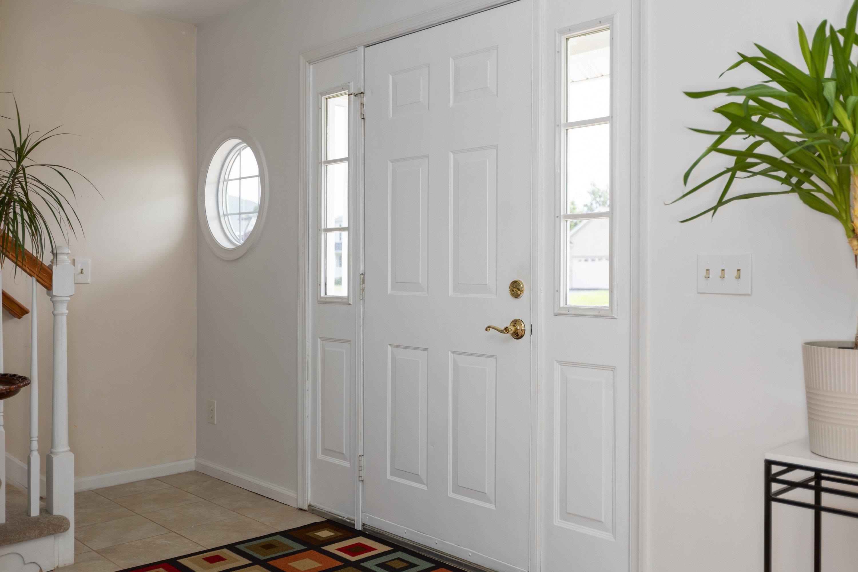 536 Three Leagues Road McGaheysville, VA 22840 - Photo 3 of 71 The foyer space features an open concept to the staircase leading to the upper level of the home, a living room space, and hallway leading to the kitchen of the home.