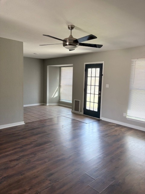 1917 Castle Gate Circle San Marcos, TX 78666 - Photo 4 of 21 Spare room with ceiling fan and dark wood finished floors