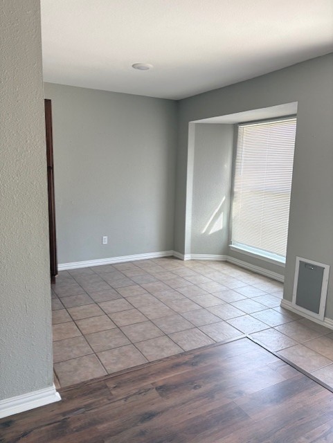 1917 Castle Gate Circle San Marcos, TX 78666 - Photo 5 of 21 Empty room with baseboards and light wood-style floors
