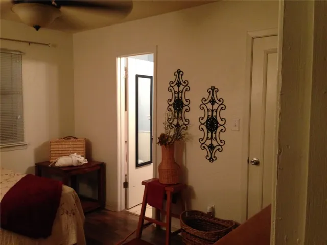 a view of a livingroom with furniture and hardwood floor
