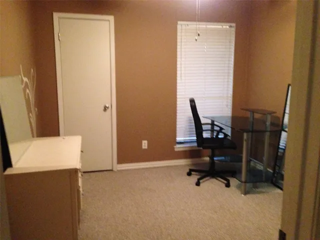 a view of a workspace with furniture