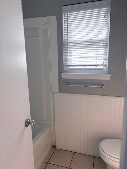 1917 Castle Gate Circle San Marcos, TX 78666 - Photo 10 of 21 Bathroom with a wainscoted wall and light tile patterned floors