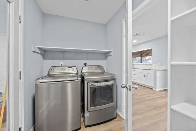 a view of a kitchen with washer and dryer