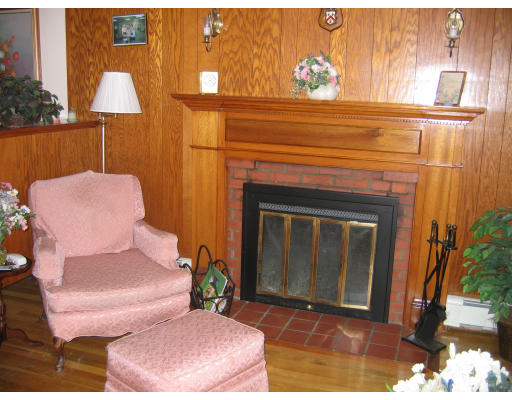 1 Samoset Road Woburn, MA 01801 - Photo 5 of 11 a living room with furniture and a fireplace