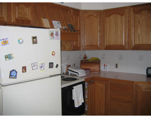 1 Samoset Road Woburn, MA 01801 - Photo 6 of 11 a kitchen with a refrigerator and a stove