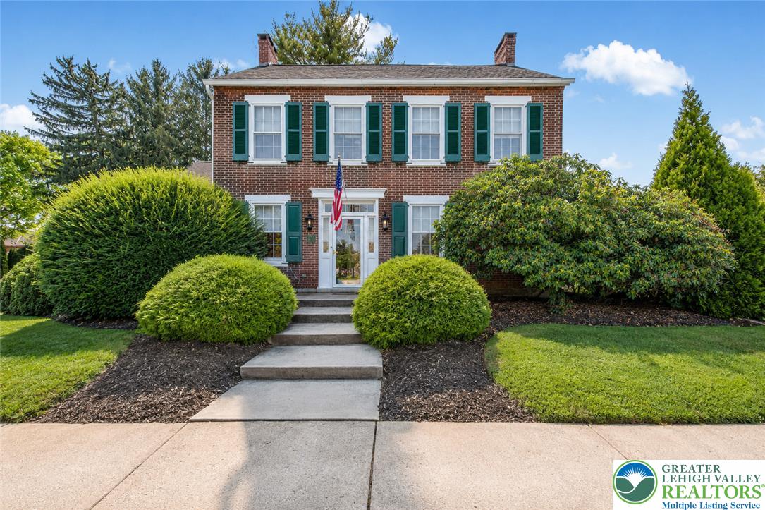 1742 Butztown Road Bethlehem, PA 18017 - Photo 2 of 56 Classic brick facade with grand center steps, mature evergreens, and beautifully maintained grounds