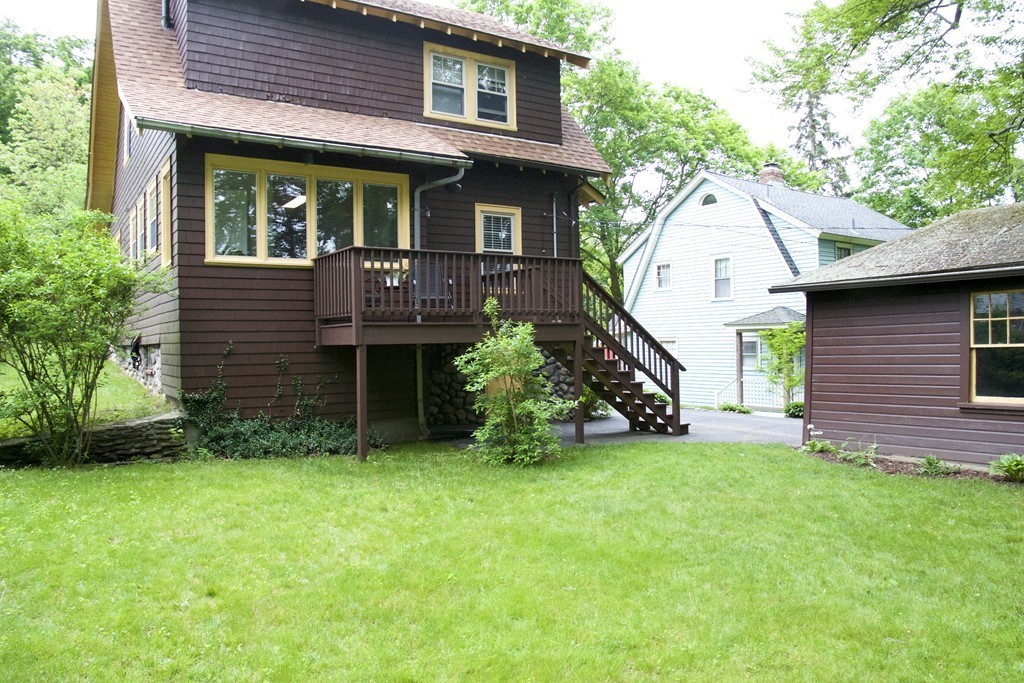 41 Havelock Road Worcester, MA 01602 - Photo 30 of 30 a view of a house with brick walls and a yard with a large tree