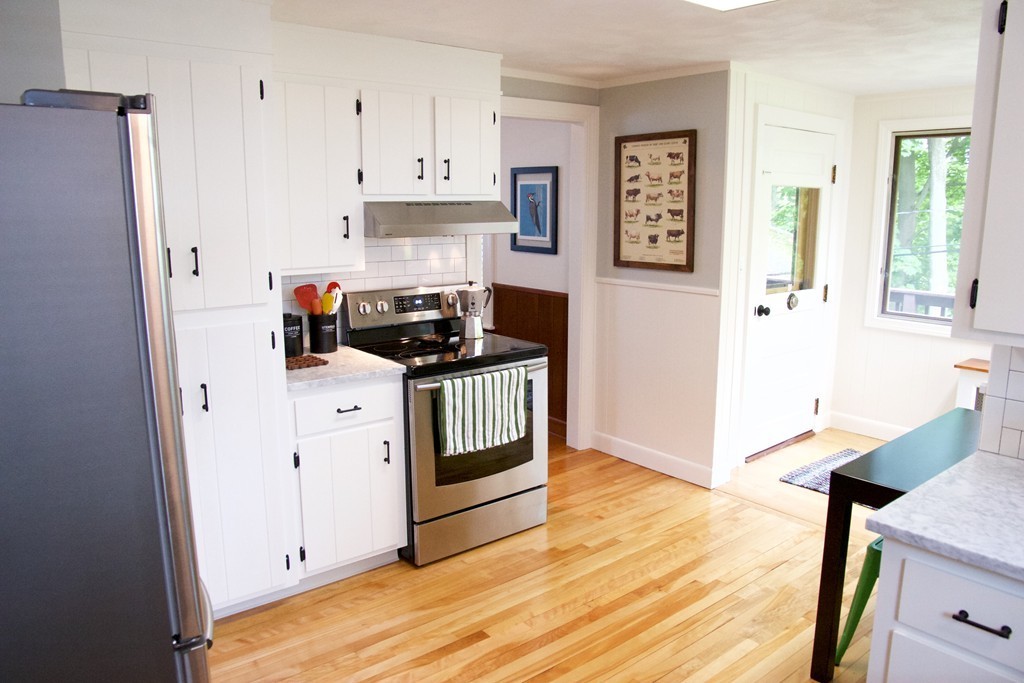 41 Havelock Road Worcester, MA 01602 - Photo 4 of 30 a kitchen with stainless steel appliances a stove a refrigerator and cabinets