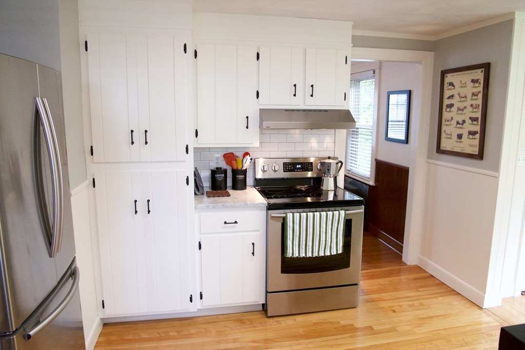 41 Havelock Road Worcester, MA 01602 - Photo 6 of 30 a kitchen with stainless steel appliances a stove a refrigerator and cabinets