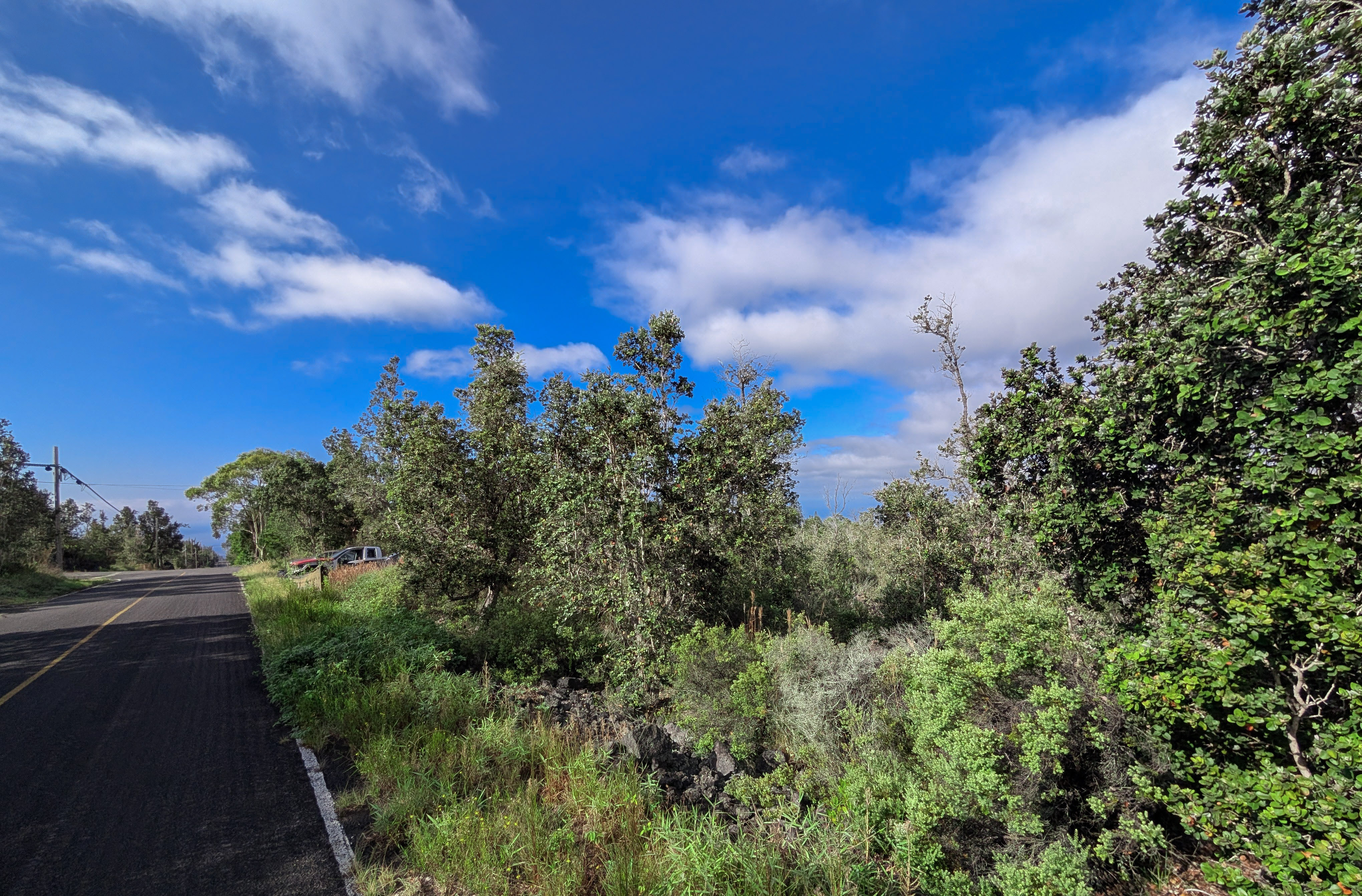 28 Catamaran Lane Ocean View, HI 96704 - Photo 3 of 12 a view of a city with lush green forest