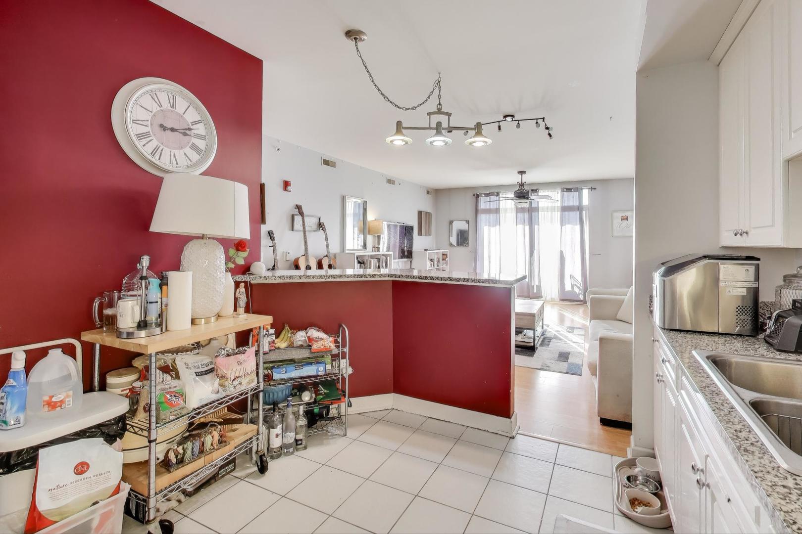 8300 Callie Avenue, Unit 310 Morton Grove, IL 60053 - Photo 13 of 25 a kitchen with stainless steel appliances granite countertop a sink dishwasher stove and cabinets