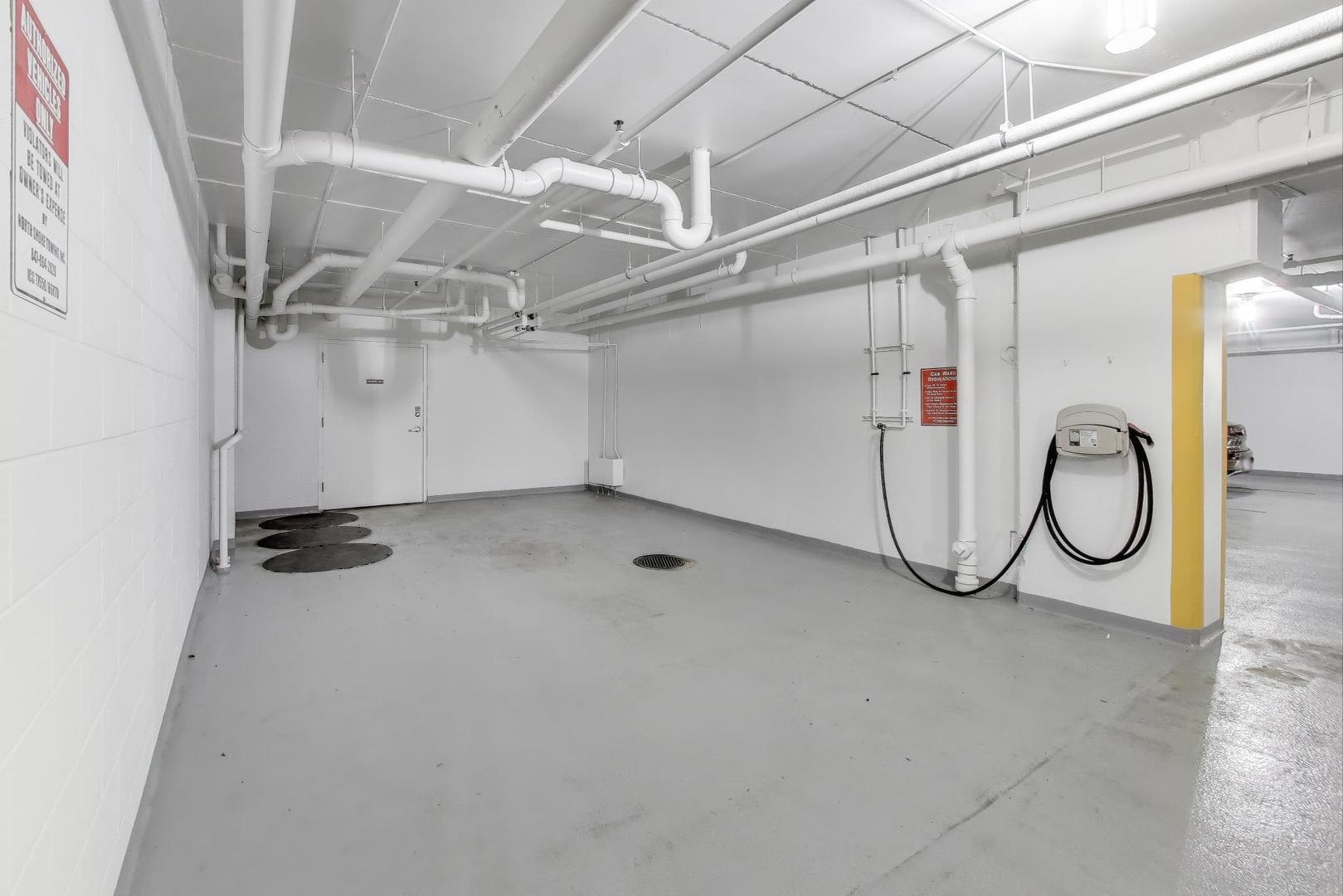 8300 Callie Avenue, Unit 310 Morton Grove, IL 60053 - Photo 23 of 25 a view of a garage with rack and bicycle