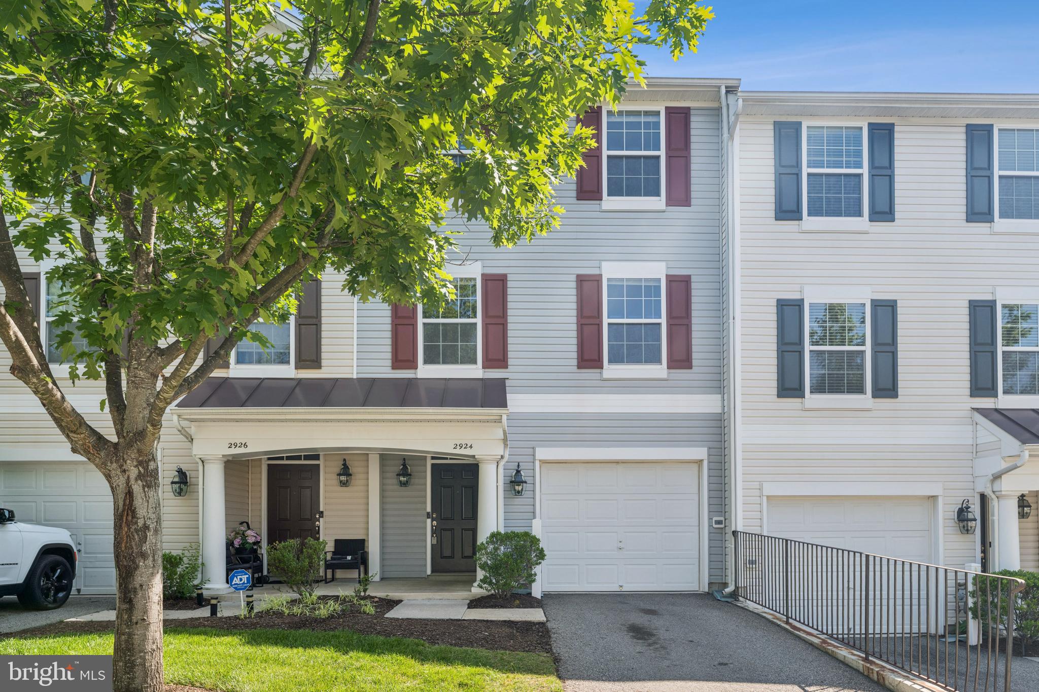 2924 Truffle Oak Place Woodbridge, VA 22191 - Photo 1 of 27 a front view of a house with yard and garage
