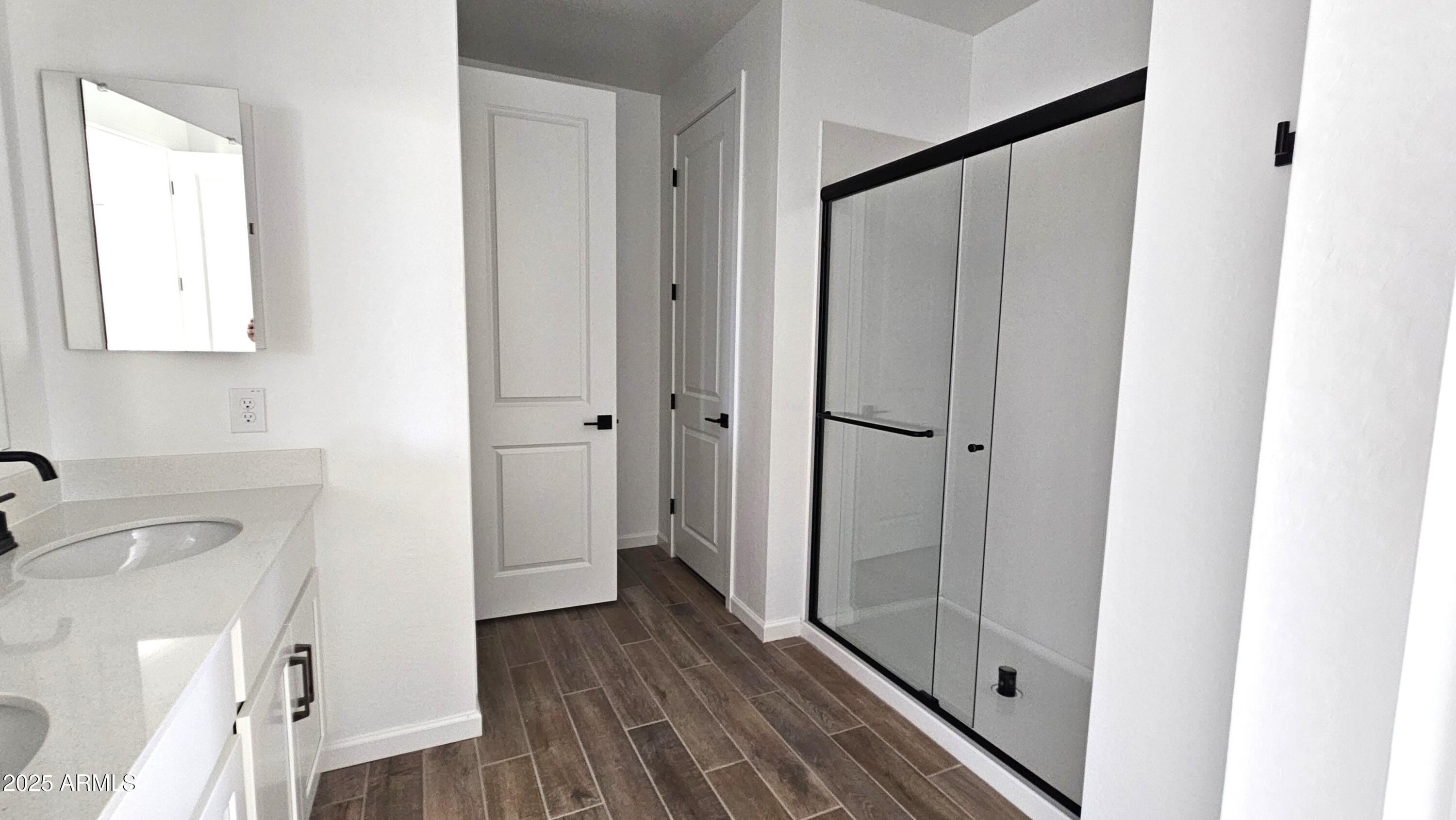 6443 East Fiddleneck Street San Tan Valley, AZ 85140 - Photo 15 of 26 a bathroom with a sink and a mirror
